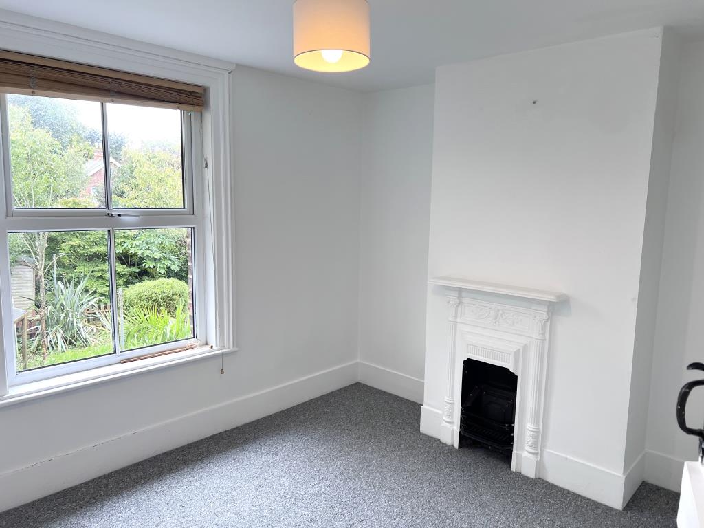 Lot: 65 - TWO-BEDROOM COTTAGE FOR INVESTMENT OR OCCUPATION - Bedroom two looking out to garden at rear